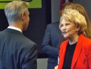 Johnelle Hunt, co-founder of J.B. Hunt Transport Services, visits with Mike Malone, the CEO of the Northwest Arkansas Council at the company’s expansion plans announcement in Lowell on Wednesday (Dec. 9).