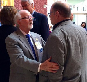 Arkansas Highway Commissioner and Arvest banker Dick Trammel talks with real estate developer Philip Taldo at the University of Arkansas’ 2016 Business Forecast Luncheon event held in Rogers on Friday (Jan. 29).