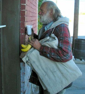 A homeless man waits at the St. John’s Episcopal Church Sack Lunch program window in downtown Fort Smith.