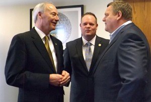 Gov. Asa Hutchinson (left) talks with Rogers Mayor Greg Hines (center) and Matthew Taylor, CEO of Belgium-based Bekaert, at the company’s announcement of a $32 million expansion in the Rogers plant. This investment will bring 100 new jobs to Rogers early next year as the plant increases it capacity by 50%.