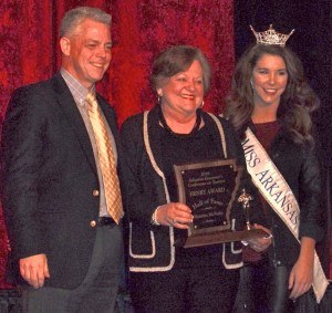 Montine McNulty, director emeritus for Arkansas State Parks, Recreation and Travel Commission, was inducted into the Tourism Hall of Fame on Monday (March 14) at the 42nd Annual Governor’s Conference on Tourism held in Springdale. Making the presentation was Kane Webb, the new director for the Arkansas Parks and Tourism and Miss Arkansas Lauren Daniels. Also induced was Bill Worthen, director of the Historic Arkansas Museum.