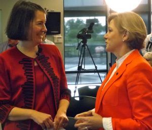 (from left) Kathleen McLaughlin, president of the Walmart Foundation and sustainability for Walmart, and Marcy Doderer, CEO of Arkansas Children's Hospital, talk prior to the $8 million gift reveal on Monday (May 10) in Springdale.