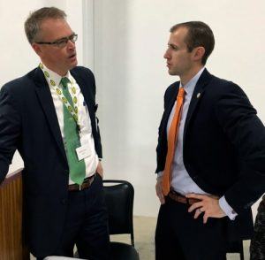 Hytrol Chairman Robert Jones (left) speaks with AEDC Executive Director Mike Preston in Jonesboro on Friday. The conveyor company hosted an open house for its 62,000-square-foot paint facility.