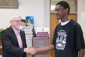 University of Arkansas Chancellor Joe Steinmetz visits Thursday (May 18) with Zabrian Mitchell, a student at Central High School in Helena-West Helena.