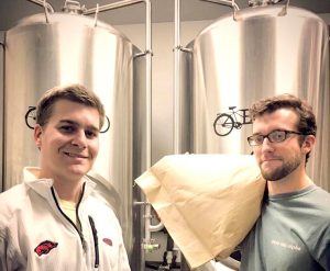 Brewmasters Zach Hickson and Sam Brehm work full-time honing their craft beer at Bike Rack Brewing Company in Bentonville. The University of Arkansas graduates were recruited by the brewery owners more than a year ago when they heard the pitch their own business plan in front of Wal-Mart employees.