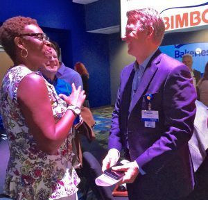 Tony Rogers, chief marketing officer for Walmart U.S., visits Tuesday (July 12) with an attendee of the Bentonville-Bella Vista Chamber of Commerce WalStreet Breakfast.