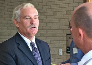 U.S. Department of Agriculture Deputy Secretary Michael Scuse visits with an attendee of the USDA New Farmers and Land Tenure forum held Monday (Aug. 29) at the University of Arkansas.