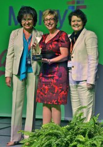 Celia Swanson (middle) won the 2016 Athena Woman of the Year award. She is pictured here with Melissa Smith (left) of McKee Foods, who presented her with the award, and Krista Khone, vice president of special projects and leadership at the Bentonville-Bella Vista Chamber of Commerce.
