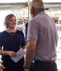 Marcy Doderer, CEO of Arkansas Children’s Hospital, visits with John Tyson, board chairman of Tyson Foods Inc., at the specialty hospital’s “topping out” ceremony in Springdale on Wednesday (Sept. 28).