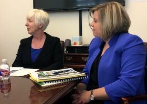 (from left) Department of Human Services Director Cindy Gillespie, and Mischa Martin, director of the Division of Children and Family Services, which manages the foster care program.