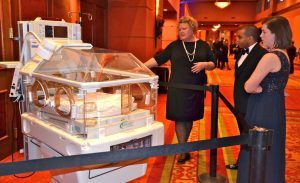 Jeri Power, nurse manager on the women’s and children’s floor at Mercy Hospital, told guests about the benefits of the fetal monitor and the Omni/Giraffe infant warmer.